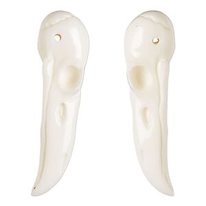 Focal, bone (bleached), 39x11mm hand-cut single-sided carved raven skull, Mohs hardness 2-1/2. Sold individually.