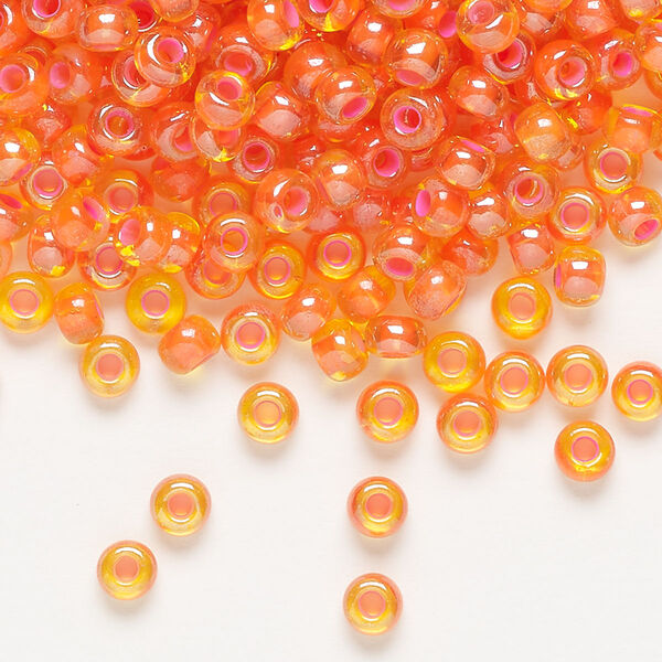 Seed bead, Preciosa Ornela, glass, translucent pink-lined luster yellow amber, #6 rocaille. Sold per 50-gram pkg. image number 0