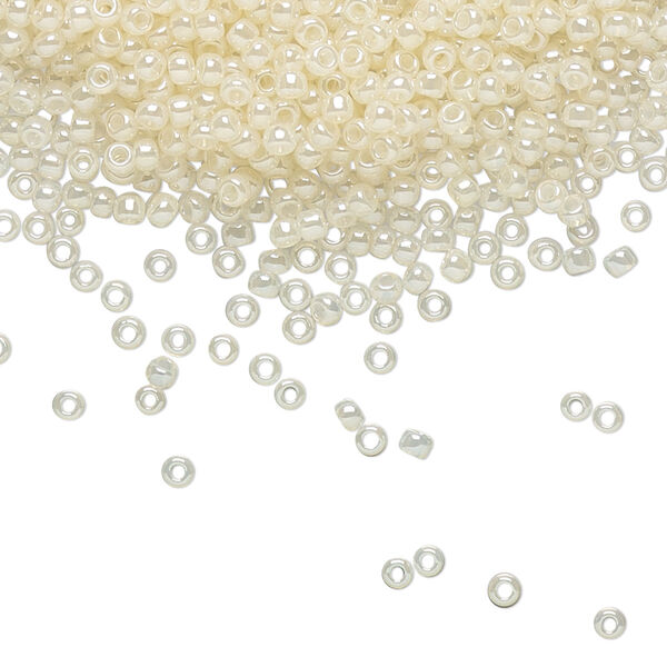 Seed bead, TOHO BEADS®, glass, pkg/50g, #11 round, translucent ceylon light ivory (TR-11-147). image number 0