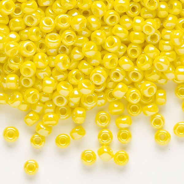 Seed bead, Dyna-Mites™, glass, opaque rainbow yellow, #6 round. Sold per 40-gram pkg. image number 0