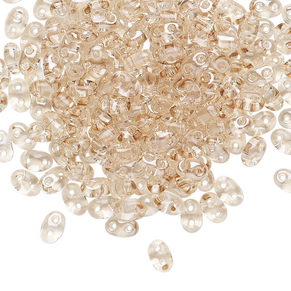Seed bead, Preciosa Twin™ Czech glass, pkg/50g, 5x2.5mm oval, transparent honey crystal clear, (20201). image number 0