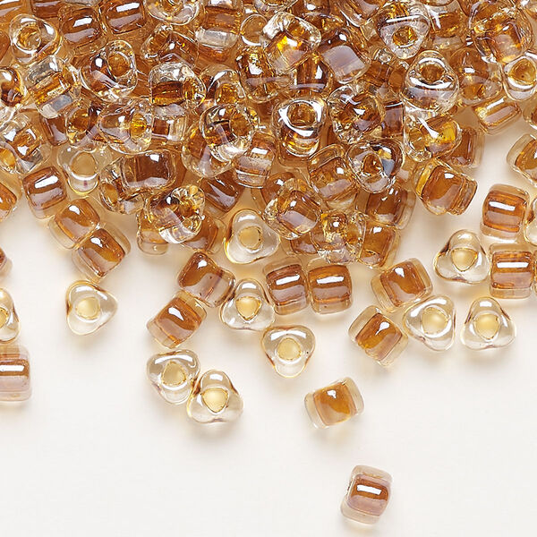 Seed bead, Miyuki, glass, transparent clear color-lined amber yellow, (TR1108), #5 triangle. Sold per 25-gram pkg. image number 0