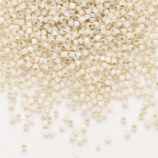 Seed bead, Delica®, glass, pkg/7.5g, #11 round, translucent silver-lined glass enamel pale cream opal (DB-1451). image number 0