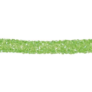 Tube, PVC plastic and glass rhinestone, transparent green, 6-7mm wide. Sold per 8-inch section.