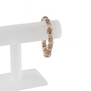 Bracelet, stretch, nylon / gold- / silver- / copper-plated brass, 8x6mm oval jumpring, 9 inches. Sold individually.