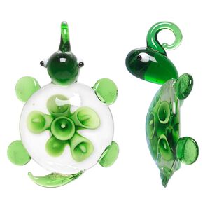 Pendant, lampworked glass, green / white / black, 50x32mm single-sided turtle with flower. Sold individually.