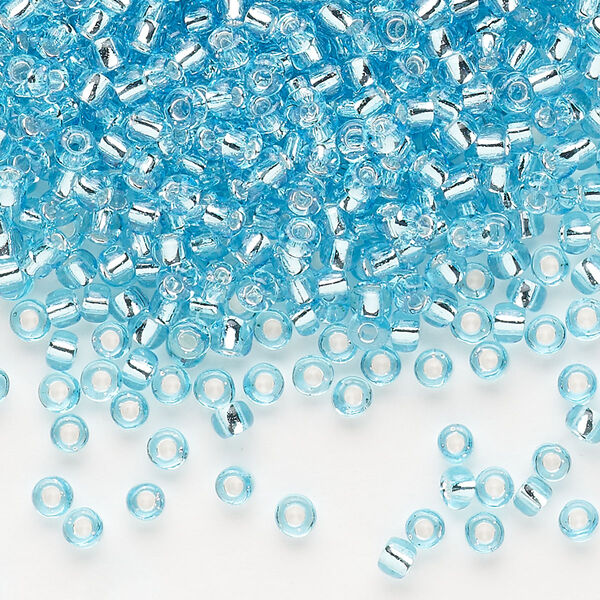 Seed bead, Dyna-Mites™, glass, silver-lined translucent light aqua, #8 round. Sold per 40-gram pkg. image number 0