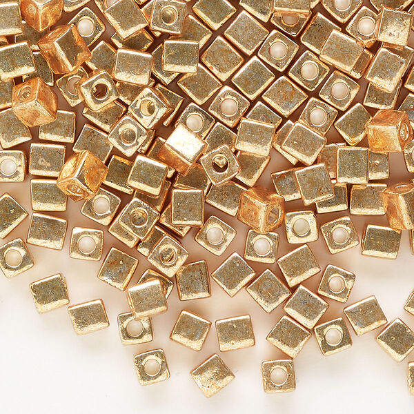 Seed bead, Miyuki, glass, pkg/25g, 3.5-3.7mm square, opaque metallic gold (SB-1053). image number 0