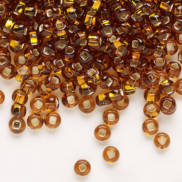 Seed bead, Preciosa Ornela Czech glass, pkg/500g, #6 rocaille, transparent silver-lined dark topaz, (17090). image number 0