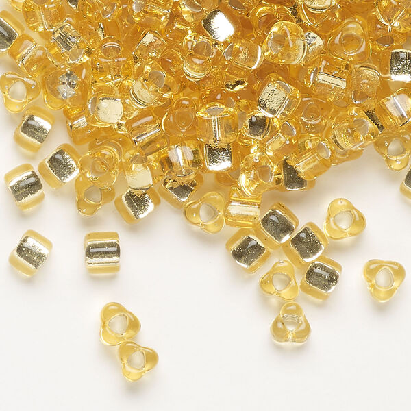 Seed bead, Miyuki 1pkg10g, glass, #5 triangle, transparent silver-lined gold (TR-1102) image number 0