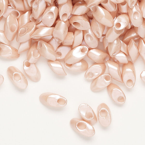 Seed bead, Miyuki, glass, pkg/10g, 7x4mm long magatama, opaque luster light salmon (LMA-429-1). image number 0