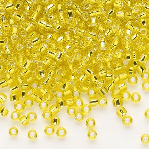 Seed bead, Dyna-Mites™, glass, silver-lined translucent yellow, #8 round. Sold per 1/2 kilogram pkg.
