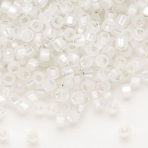 Seed bead, Dyna-Mites™, glass, silver-lined translucent matte clear, #6 round with square hole. Sold per 1/2 kilogram pkg.