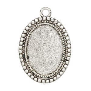Focal, glue-in, antique silver-finished "pewter" (zinc-based alloy), 32.5x26mm single-sided oval with beaded edge, 25x18mm oval setting. Sold per pkg of 2.