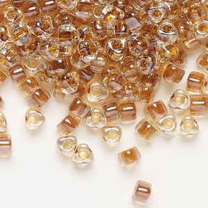 Seed bead, Miyuki, glass, transparent clear color-lined amber yellow, (TR1108), #5 triangle. Sold per 250-gram pkg.