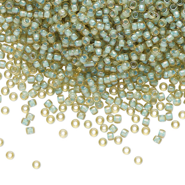 Seed bead, TOHO BEADS®, glass, pkg/7.5g, #11 round, opaque color-lined seafoam light topaz (TR-11-952). image number 0