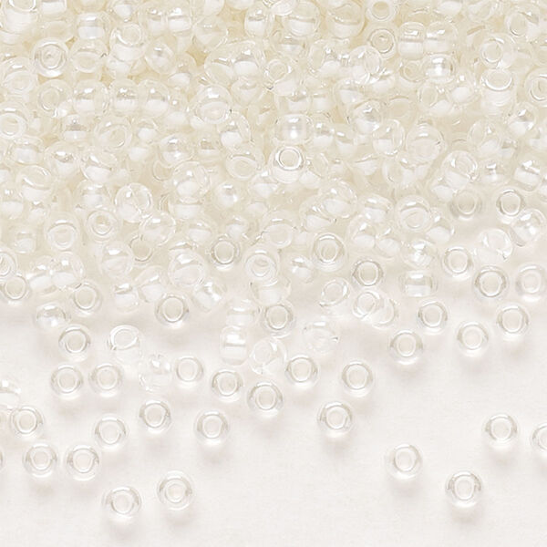 Seed bead, Preciosa Ornela Czech glass, pkg/500g, #11 rocaille, translucent color-lined luster pastel ivory, (382PI). image number 0