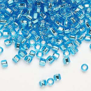 Seed bead, Dyna-Mites™, glass, silver-lined translucent aqua, #6 round with square hole. Sold per 1/2 kilogram pkg.