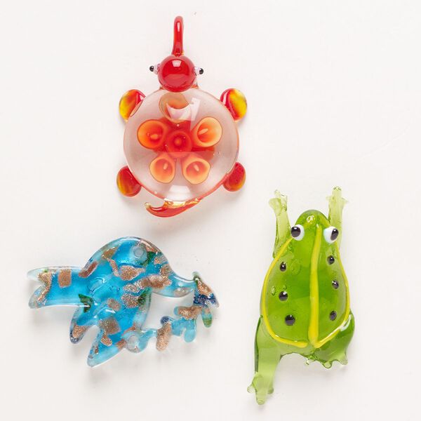 Random focal mix, lampworked glass, pkg/3, translucent and transparent mixed colors with silver-colored foil and copper-colored glitter, 35x20mm-66x48mm mixed animal shapes. image number 0