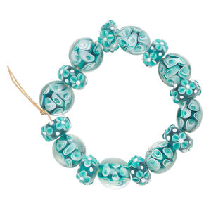 Bead, lampworked glass 1pkg16, clear / white / teal, 13mm puffed flat round and 18x10mm bumpy rondelle with assorted flower and swirl designs.
