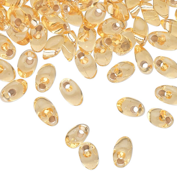 Seed bead, Miyuki, glass, pkg/10g, 7x4mm long magatama, transparent silver-lined light gold (LMA-3). image number 0