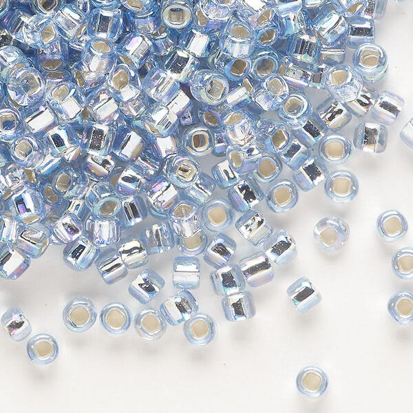 Seed bead, Dyna-Mites™, glass, silver-lined translucent rainbow light grey, #6 round with square hole. Sold per 40-gram pkg. image number 0
