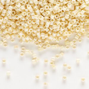 Seed bead, Delica®, glass, pkg/7.5g, #10 round, opaque rainbow cream (DBM-0157).
