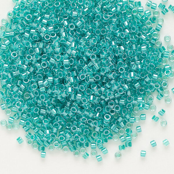 Seed bead, Delica®, glass, pkg/7.5g, #11 round, translucent teal green-lined luster crystal clear (DB-0904). image number 0