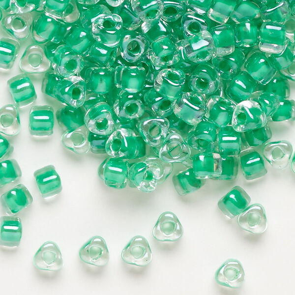 Seed bead, Miyuki, glass, transparent clear color-lined kelly green, (TR1130), #5 triangle. Sold per 25-gram pkg. image number 0