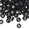 Bead mix, acrylic, opaque black and white, 7mm double-sided flat round with alphabet letters. Sold per pkg of 200. image number 0
