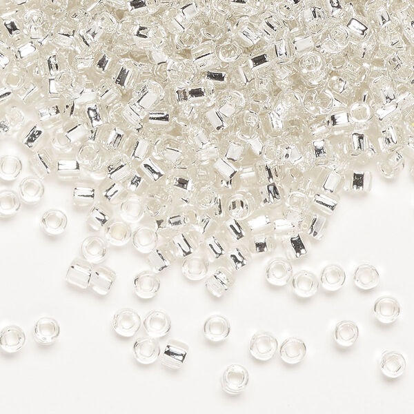 Seed bead, Dyna-Mites™, glass, silver-lined translucent clear, #8 round with square hole. Sold per 1/2 kilogram pkg. image number 0