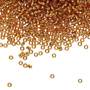 Seed bead, TOHO BEADS®, glass, pkg/7.5g, #11 round, transparent silver-lined topaz (TR-11-22C).