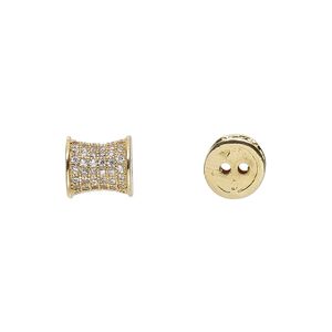 Bead, glass rhinestone and gold-finished brass, clear, 9x8mm pinched cylinder with 2 holes. Sold individually.