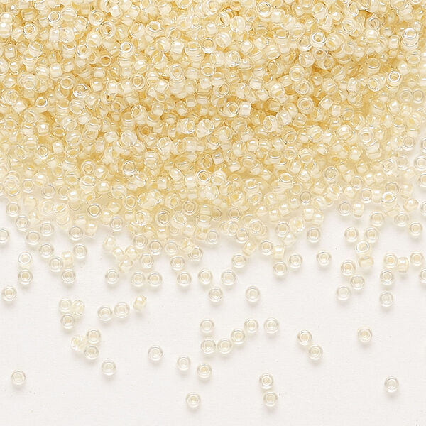 Seed bead, Miyuki, glass, pkg/35g, #15 rocaille, translucent ivory-lined luster crystal clear (RR-2215). image number 0