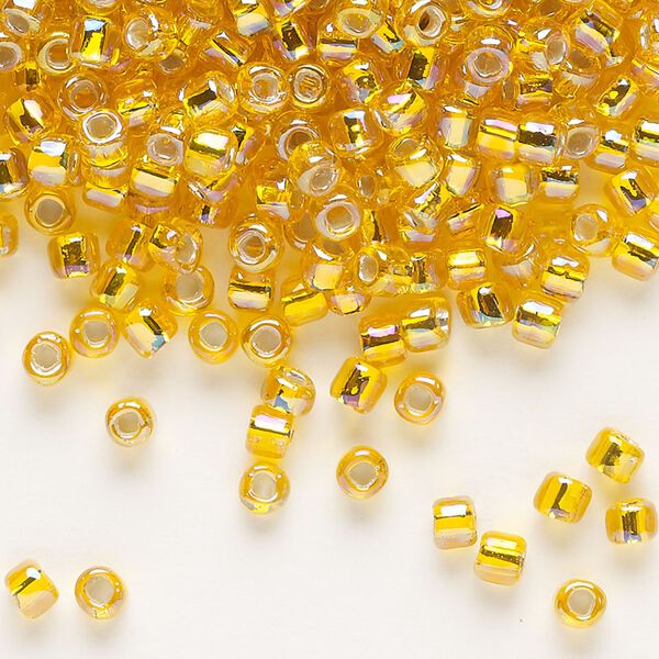 Seed bead, Dyna-Mites™, glass, silver-lined translucent rainbow orange, #6 round with square hole. Sold per 1/2 kilogram pkg. image number 0