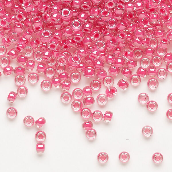 Seed bead, Miyuki, glass, pkg/250g, #8 rocaille, translucent carnation pink-lined luster crystal clear (RR-208). image number 0