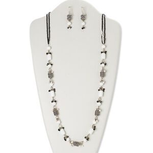 Necklace and earring set, glass / silver-finished steel / brass / antiqued silver-finished brass, black and white, 32 inches with lobster claw clasp, 2-1/4 inch earrings with fishhook ear wire. Sold per set.