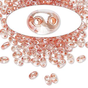 Seed bead, Preciosa Twin™ Czech glass, pkg/10g, 5x2.5mm oval, transparent peach terra color-lined clear, (38689).