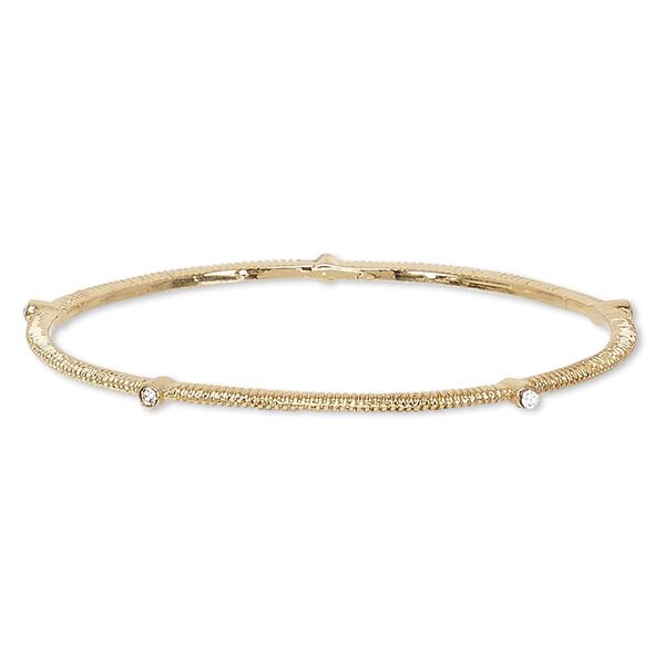 Bracelet, bangle, glass rhinestone and gold-finished brass, clear, 3mm wide with corrugated design, 8 inches. Sold individually. image number 0