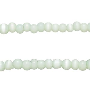Bead, cat's eye glass (fiber optic glass), sea green, 4x3mm-5x4mm uneven round. Sold per pkg of (2) 14-inch strands, approximately 200 beads.