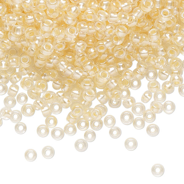 Seed bead, Preciosa Ornela Czech glass, pkg/500g, #8 rocaille, translucent color-lined luster pastel apricot, (382PA). image number 0