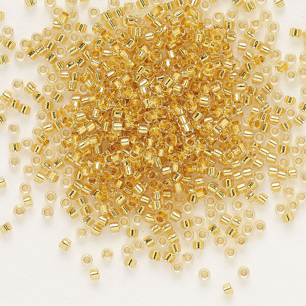 Seed bead, Delica®, glass, pkg/4g, #11 round, transparent 24Kt gold-lined crystal gold (DB-0033). image number 0