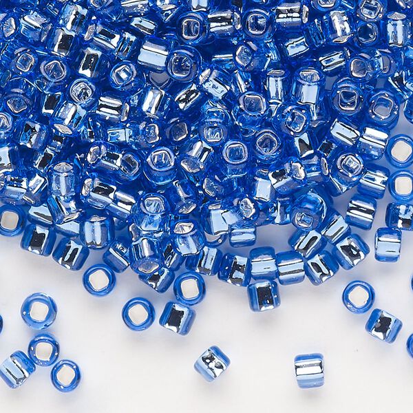 Seed bead, Dyna-Mites™, glass, silver-lined translucent blue, #6 round with square hole. Sold per 40-gram pkg. image number 0
