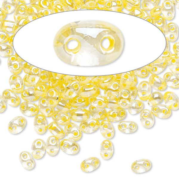 Seed bead, Preciosa Twin™ Czech glass, pkg/10g, 5x2.5mm oval, transparent yellow terra color-lined clear, (38686). image number 0