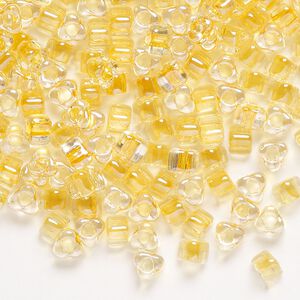 Seed bead, Miyuki, glass, transparent clear color-lined light gold, (TR1107), #5 triangle. Sold per 25-gram pkg.