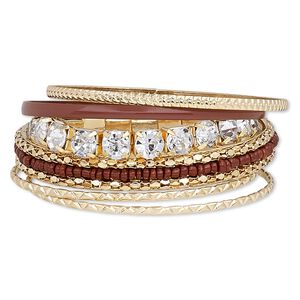 Bracelet, bangle and stretch, enamel / glass / glass rhinestone / gold-finished steel, brown and clear, 3-10mm wide with cupchain, 7-1/2 to 8-1/2 inches. Sold per 6-piece set.