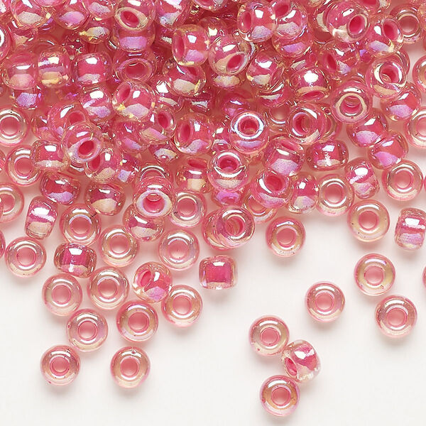 Seed bead, Miyuki, glass, pkg/25g, #6 rocaille, translucent hot pink-lined rainbow crystal clear (RR-355). image number 0