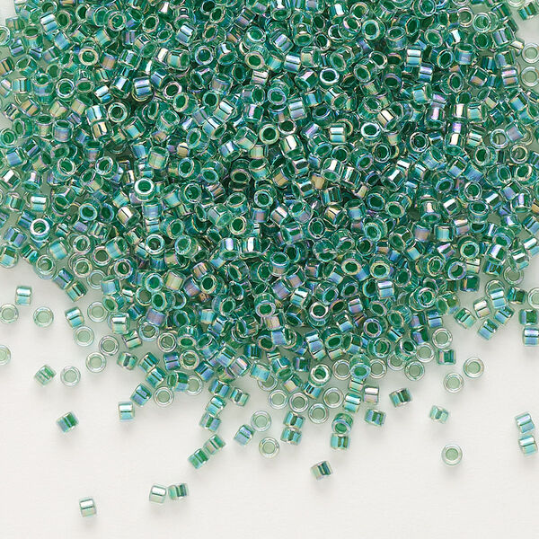 Seed bead, Delica®, glass, pkg/7.5g, #11 round, translucent lime-lined rainbow crystal clear (DB-0060). image number 0