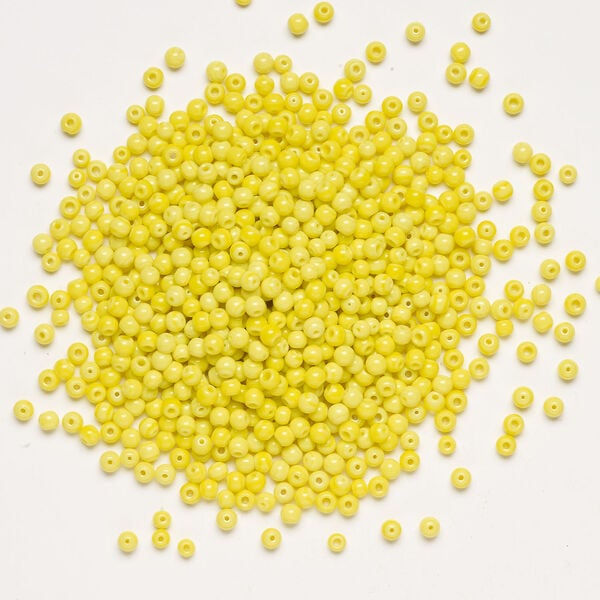 Bead, glass 1pkg4oz, opaque bright yellow, 3-5mm round. image number 1