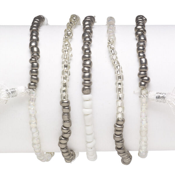 Bracelet mix, stretch, glass, mixed clear / whites / silvers, #6 round with 45mm tassel, 7-1/2 inches. Sold per pkg of 5. image number 0